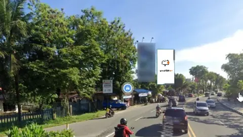 Billboard 10 × 5 m di Jl. Jendral Sudirman (area Taman Tugu Dayak Manutung), Balikpapan, Kalimantan Timur