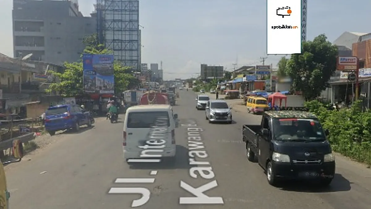 Billboard 10 × 5 m di Jl. Interchage Karawang Barat (arah Karawang - Jakarta, Depan Holland), Jawa Barat