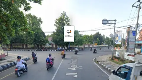 Baliho 6 × 4 m di Jl. Ade Irma Suryani 12 (Simpang Pusat Perdagangan Sumur Bandung), Metro, Lampung